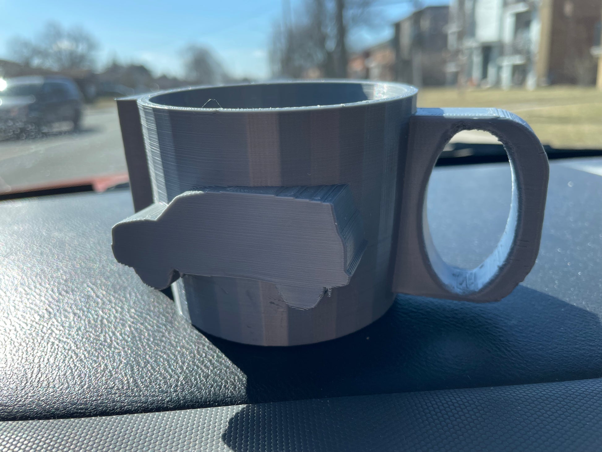 Gray 3D printed mug with a VW bus on the side.