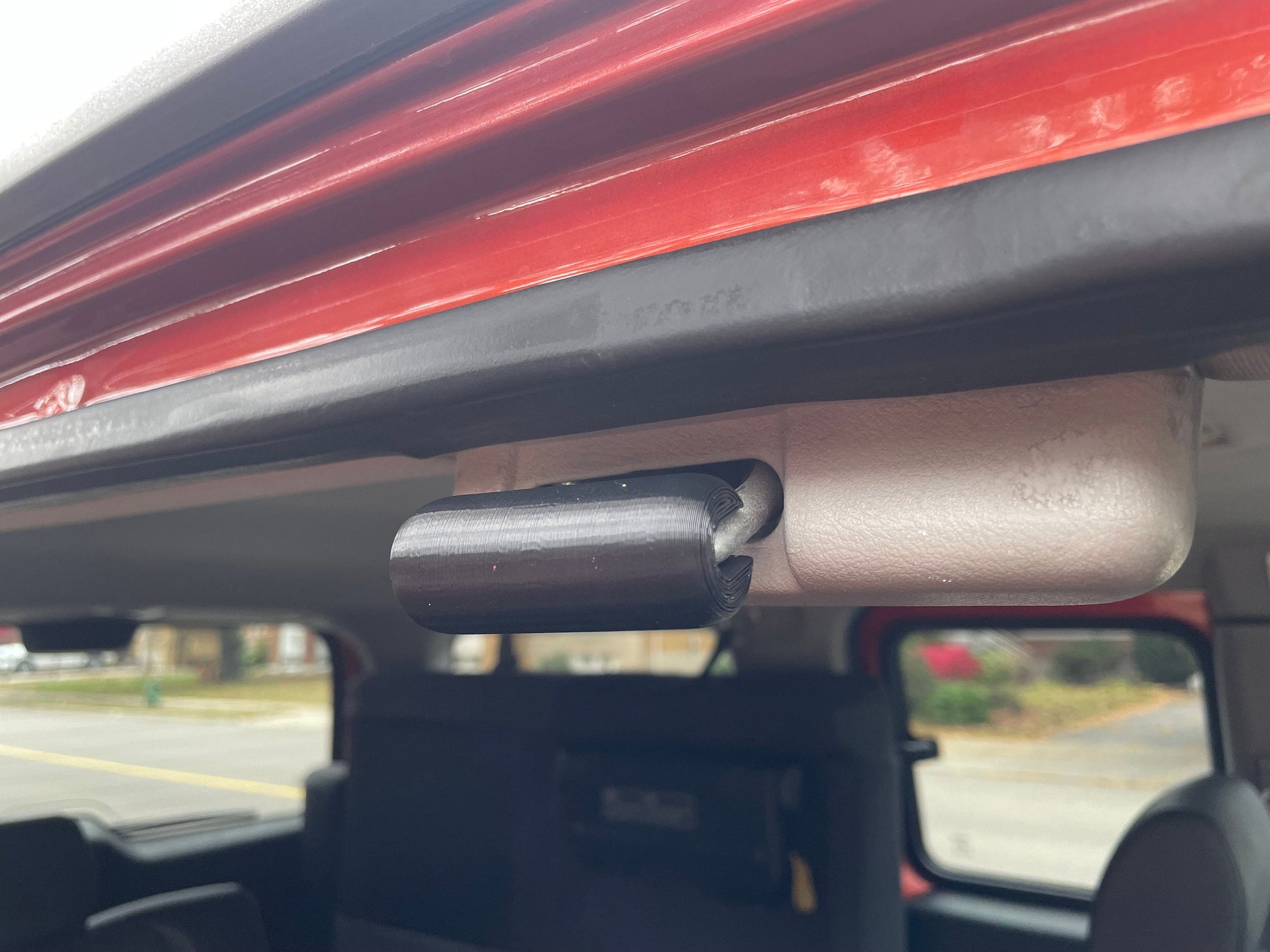 Honda Element rear door with 3D printed black door bumper guard installed.